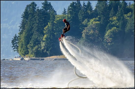 The BC Flyboard team entertained the throngs packing the beaches Saturday as they propelled high into the air and doing what look liked 'wheelies' on jets of water spray. (Julia Pelish/Vacay.ca)