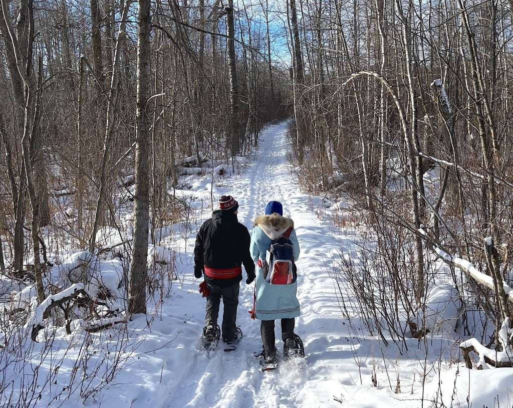 A snowshoe walk along Moss Lake in Elk Island National Park is one way to get close to nature and Indigenous history in Alberta. (Photo by Maria Jose)