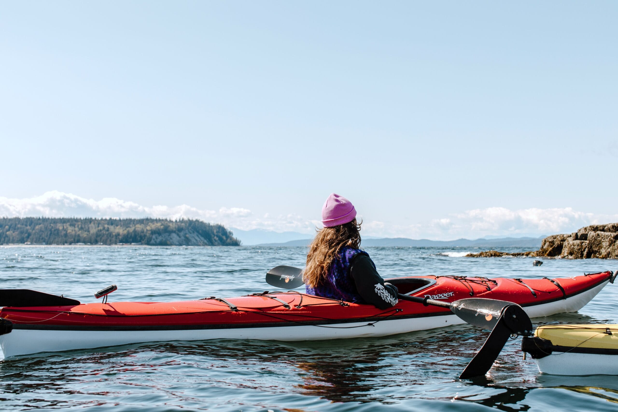 A person kayaking in Secret Cove in Halfmoon Bay on the Sunshine Coast